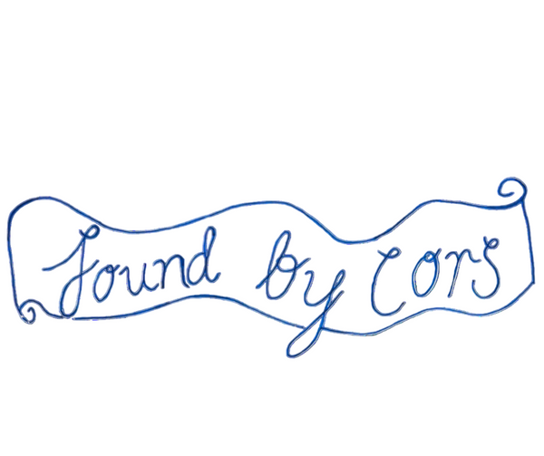 Found By Cors vintage store logo in blue writing against a white background